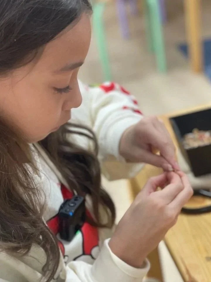 Child making a miniature craft at Konekt Club in Margate.