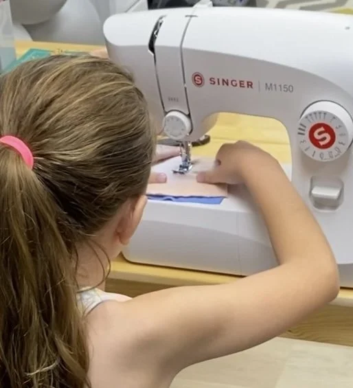Student practicing life skills in a Home Ec class at Konekt Club Broward, featuring hands-on sewing and creative DIY projects for homeschoolers.