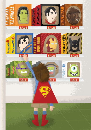 little boy in a Superman cape reaching for a Superman mask on a display of Halloween costume masks