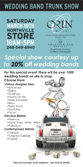 jewelry store trunk show sale featuring wedding bands and show the trunk of a Beetle with tin can hanging on the back bumper