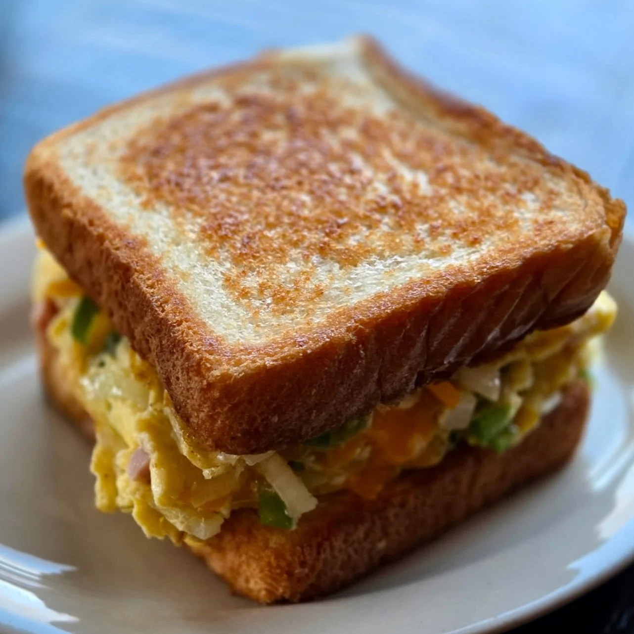 Saddle up for our newest breakfast sandwich 🤠🔥

Meet The Cowboy &mdash; built for early mornings and long days. Ham, fluffy eggs, grilled peppers &amp; onions, and melted cheddar, stacked thick on Texas toast!

Grab one before it rides off the menu
