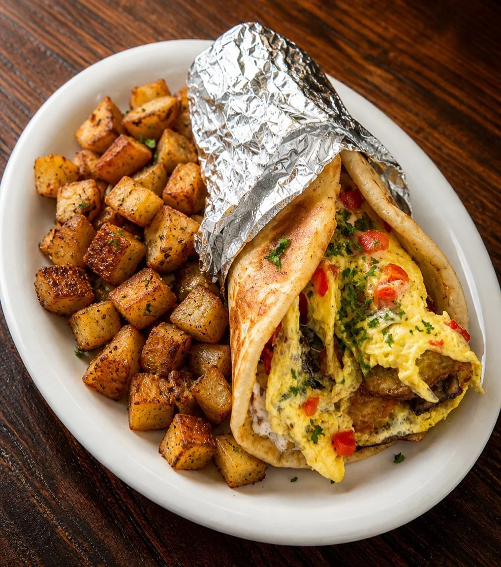 Introducing one of our newest menu additions 👀🔥

Our Greek Breakfast Gyro 🇬🇷
A warm pita stuffed with fluffy eggs, savory gyro meat, feta cheese, tomatoes, red onion, and Kalamata olives&mdash;served with crispy homefries 🤤

Part of our signatur