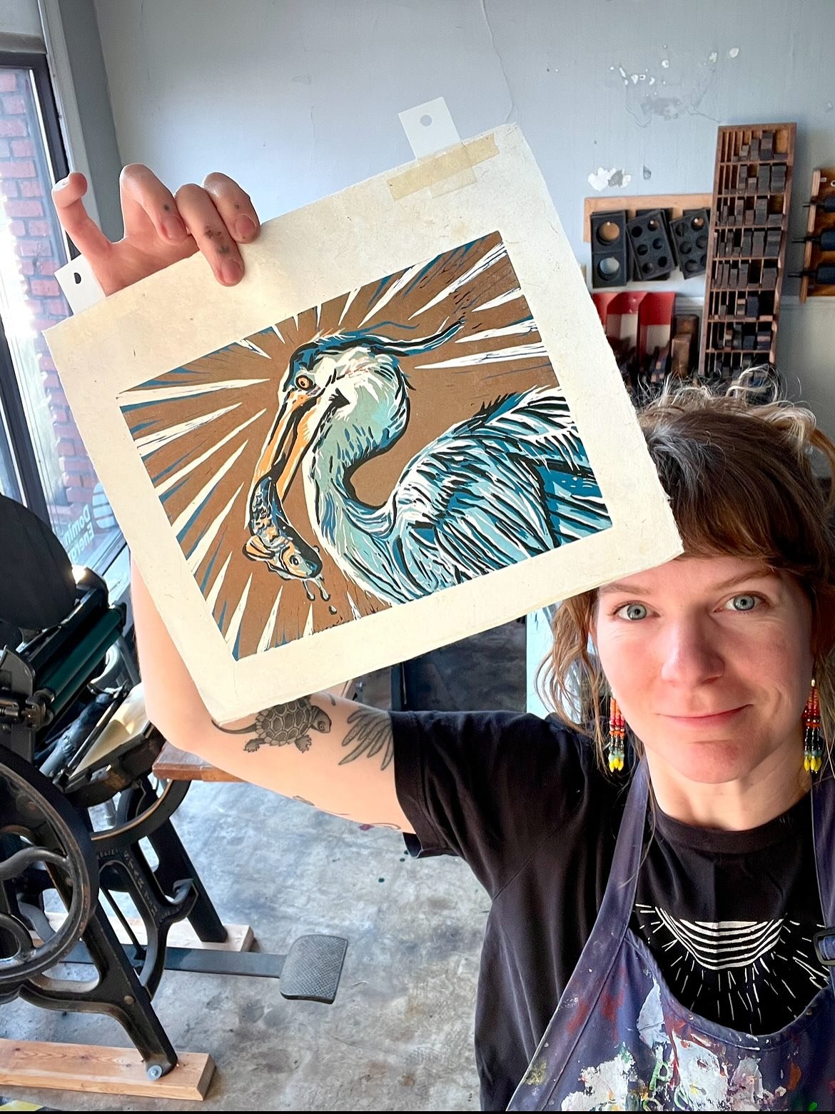 I finally finished my 5 layer reduction lino print of a blue heron and his catch of the day!