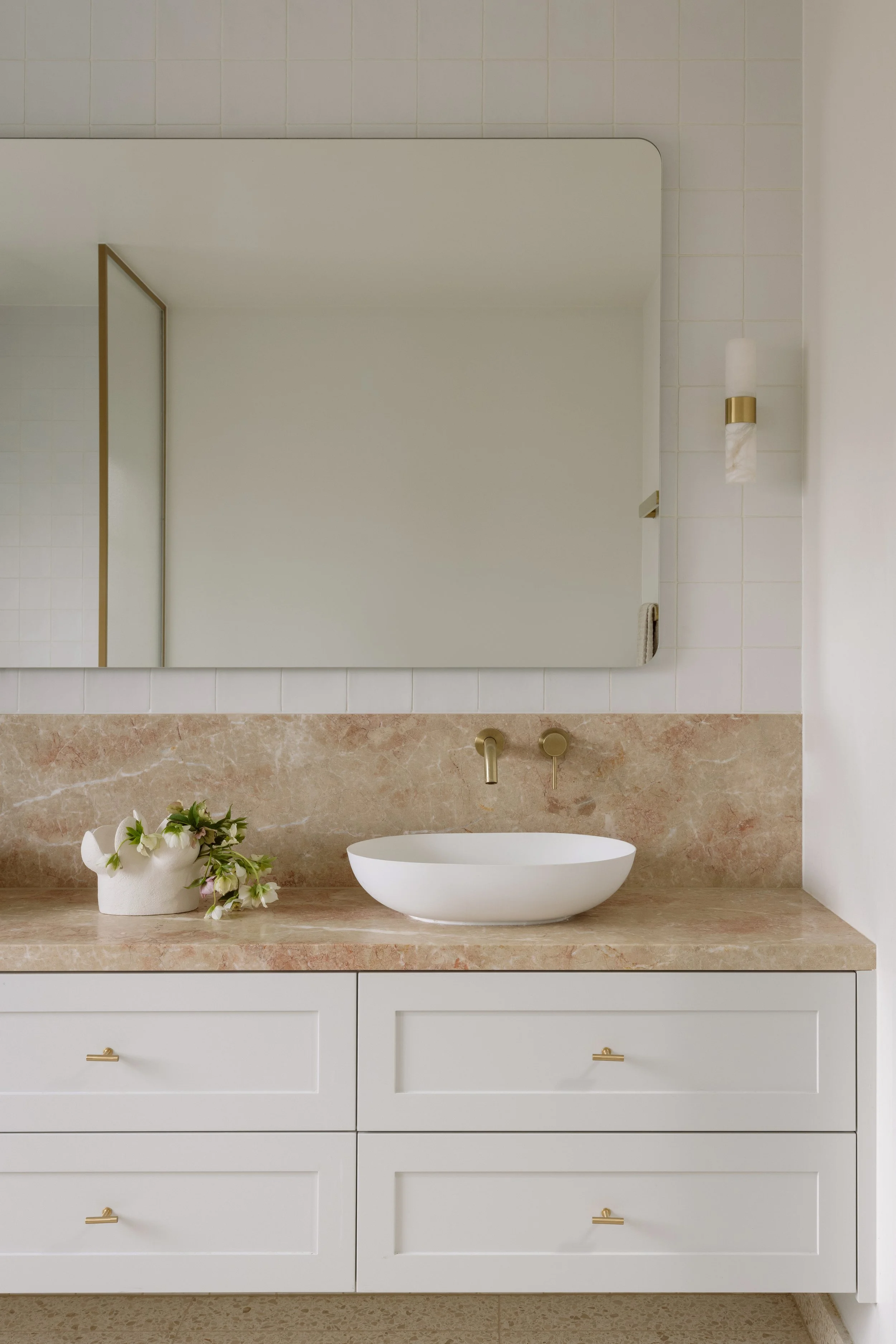 Bathroom with cloudy rose marble