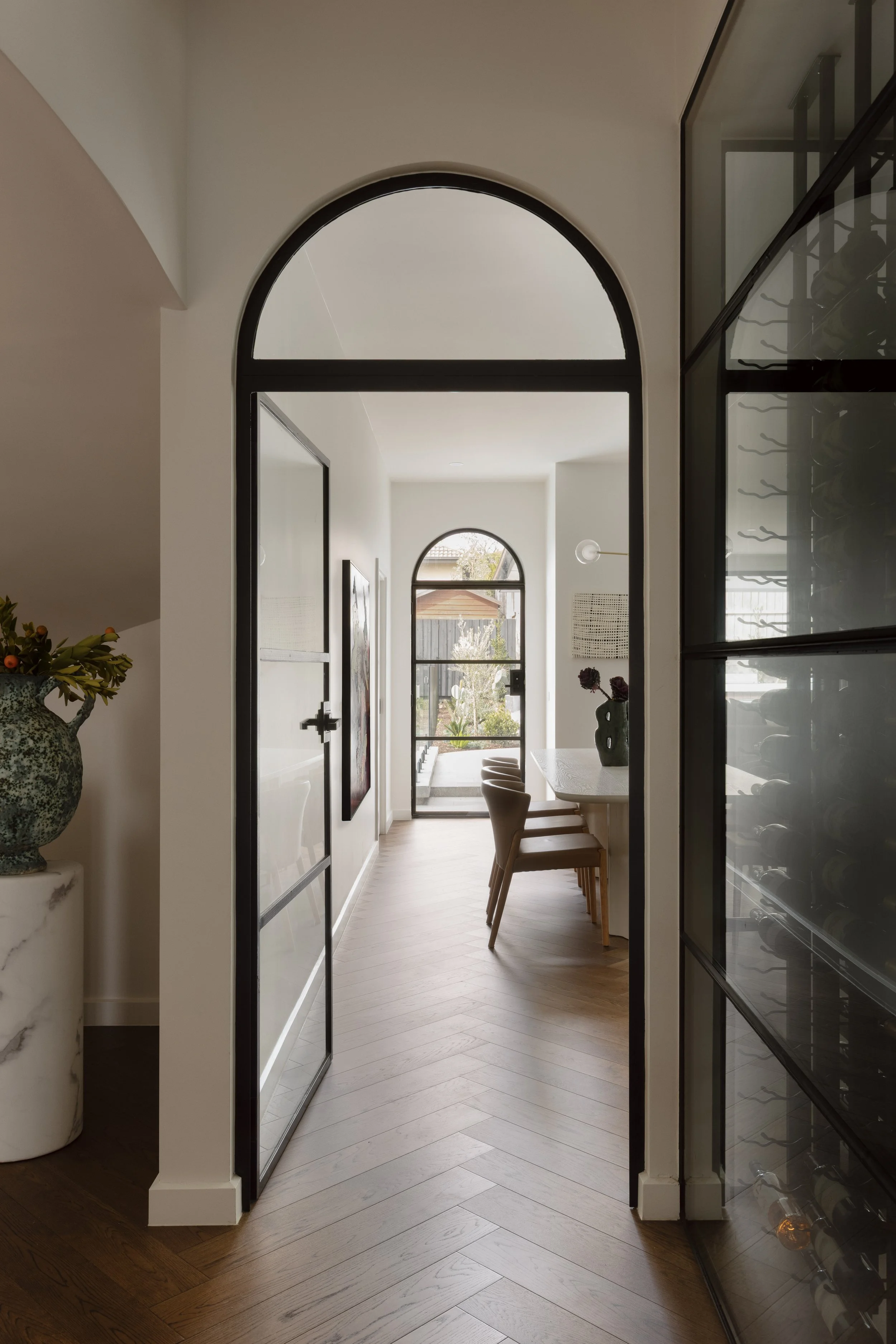 Steel door archway view to dining area