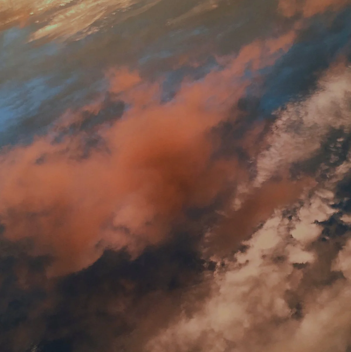Colorful clouds in the sky, with hues of orange, pink, and blue.