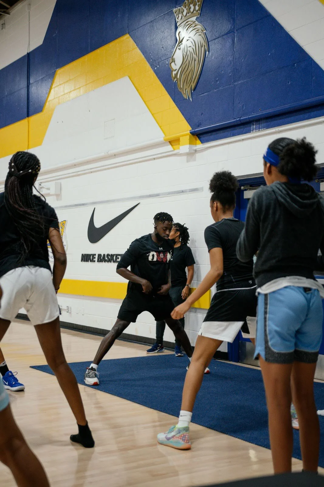 Youth basketball team working on mobility warm up