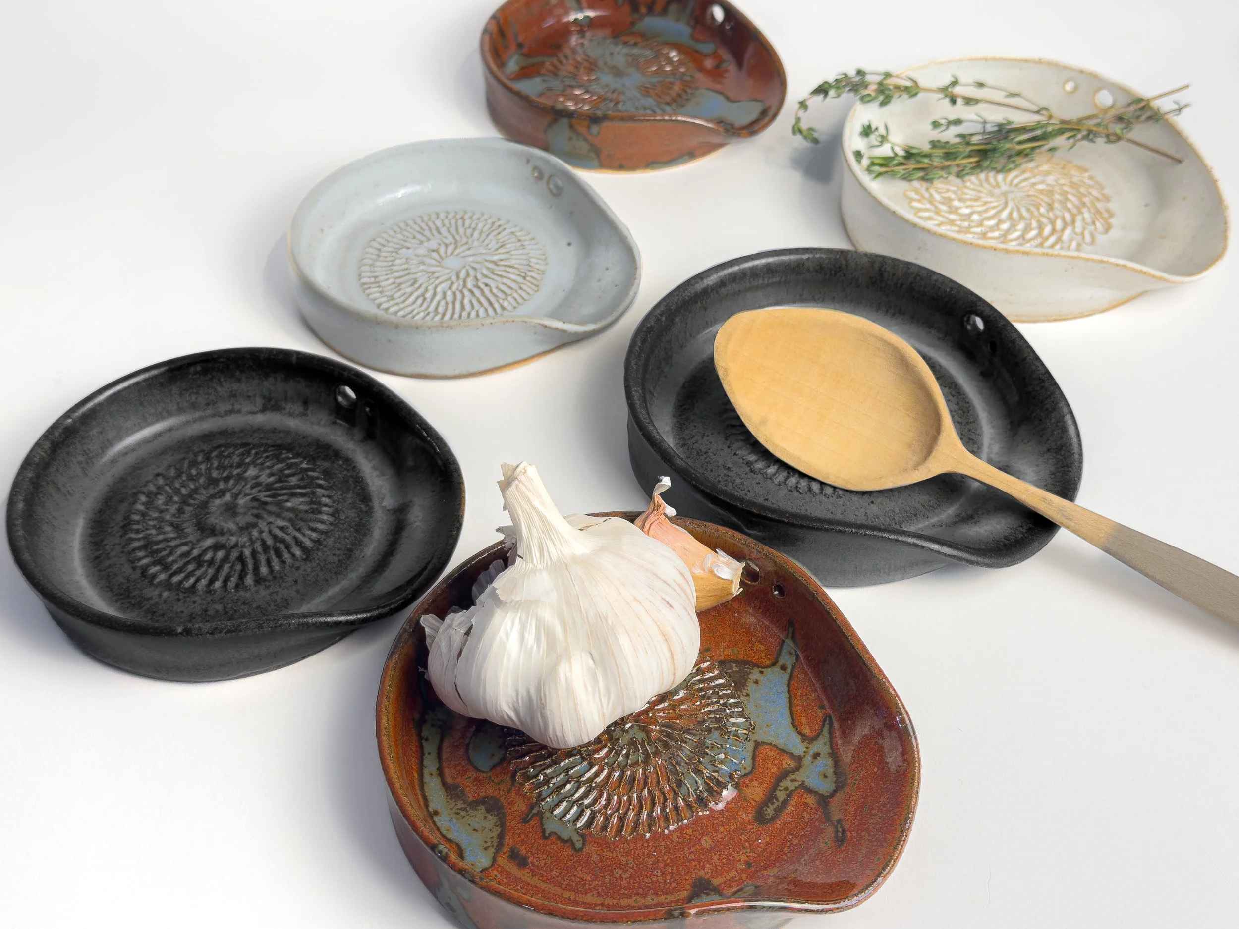 5-in-1 Ceramic garlic/ginger grater, spoon rest, herb stripper, and olive oil dipper