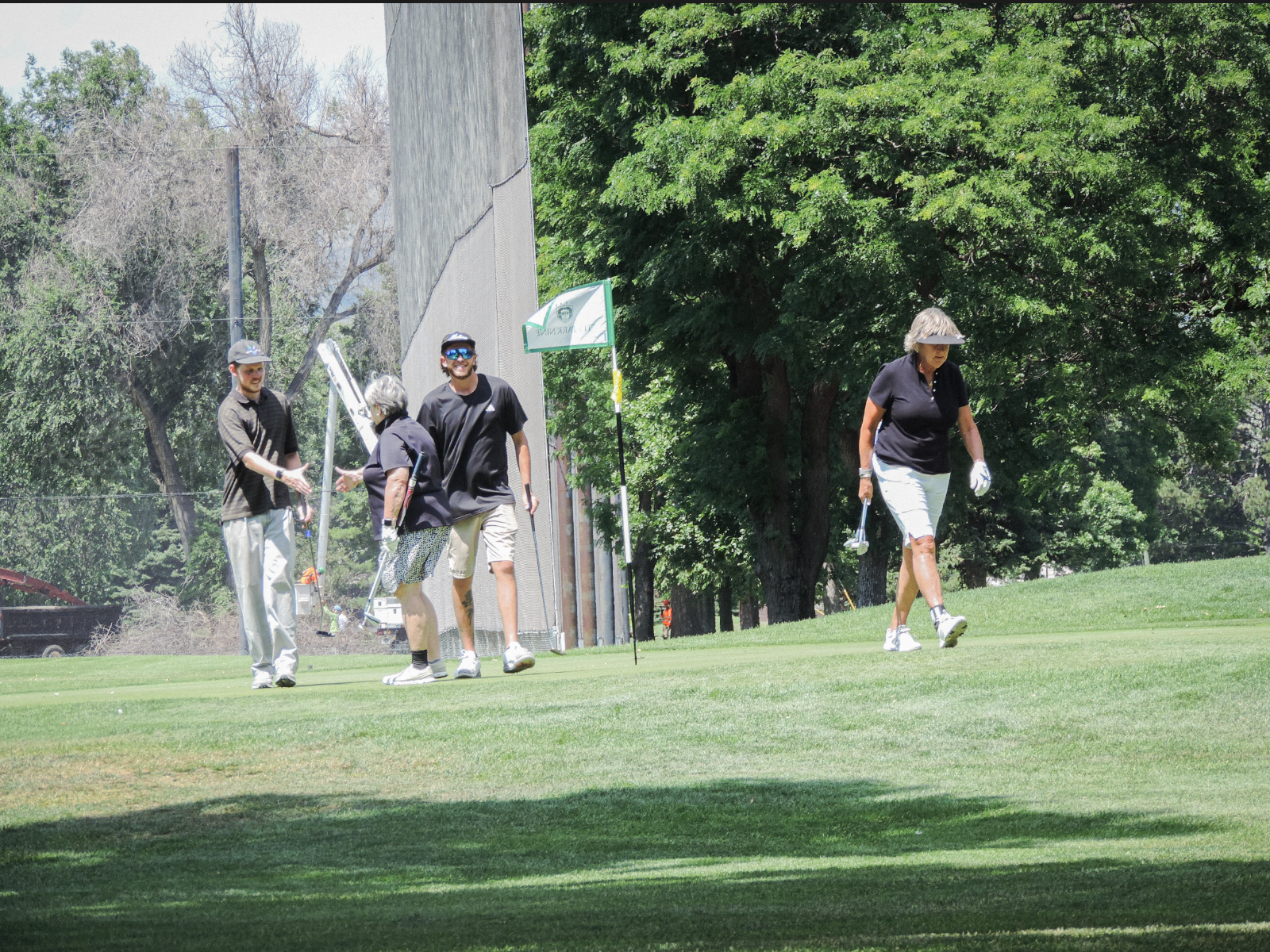 Handshakes are handed out as a display of sportsmanship after the scramble take place on the 9th green at City park golf coutse, on July 11th 2025, at 12:15pm