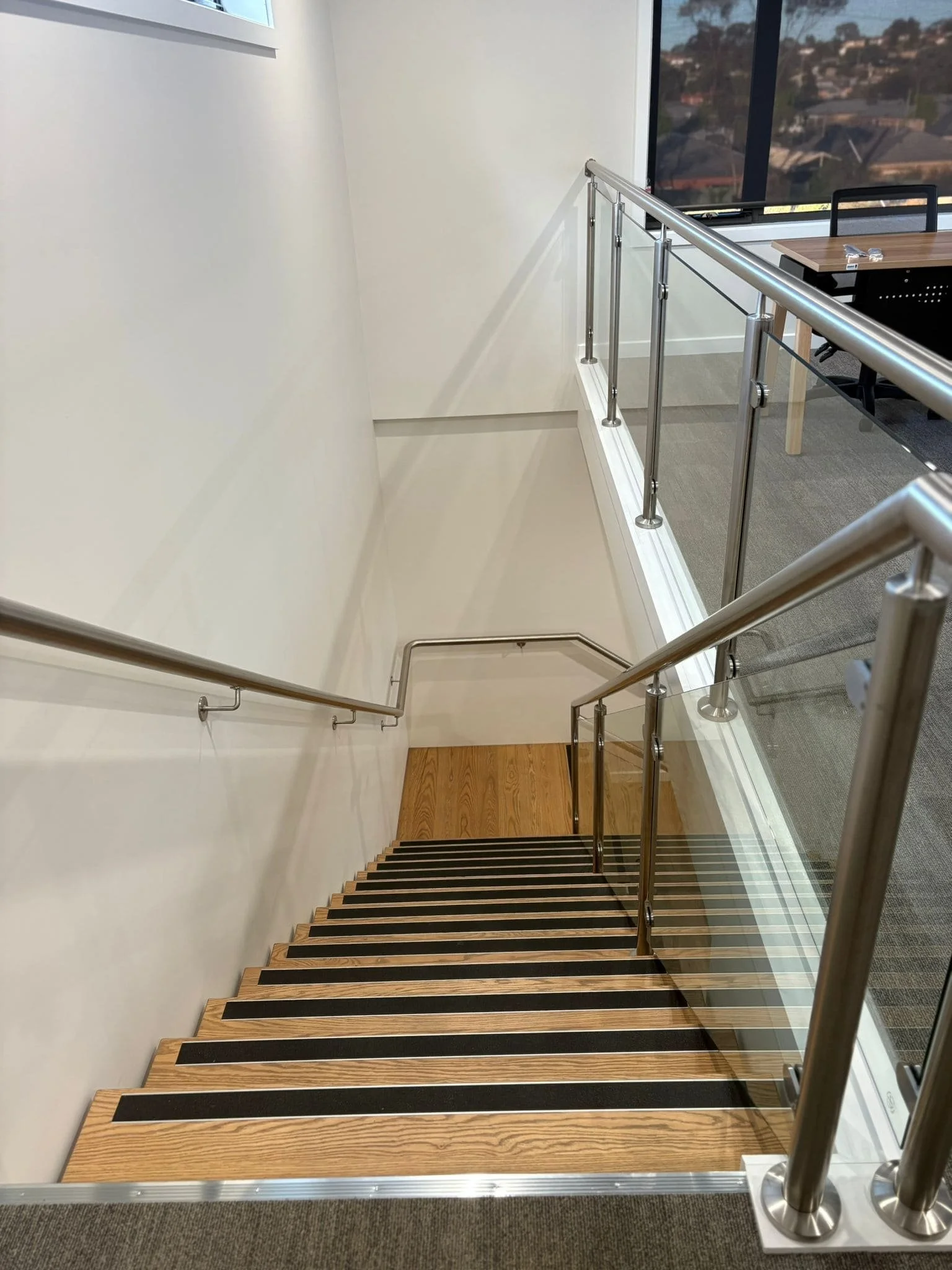 Detailed view of internal commercial staircase built by AMW Builders in Bendigo