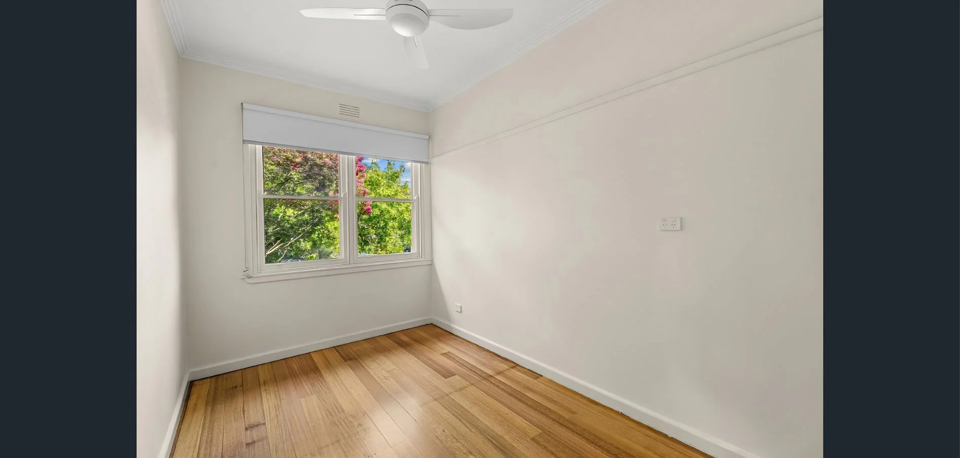 Small bedroom renovation at Hargreaves Street Bendigo featuring polished timber floors and natural light by AMW Builders.