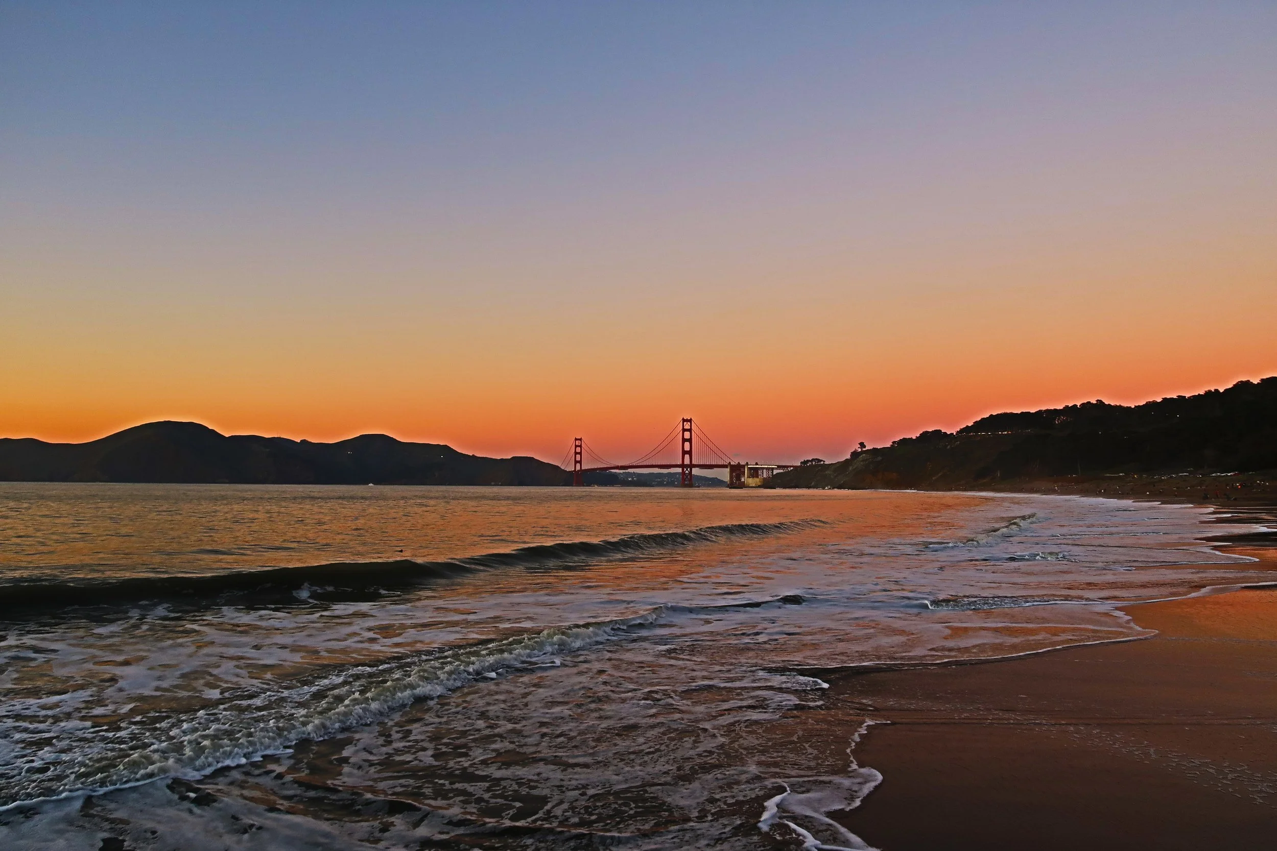 View of San Francisco Bay Bridge from Bakers Beach during Sunset