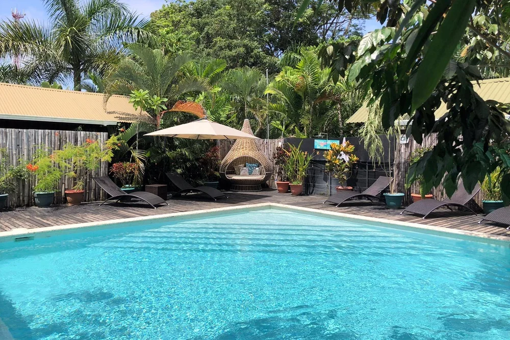 The turquoise pool at Danyasa under palms
