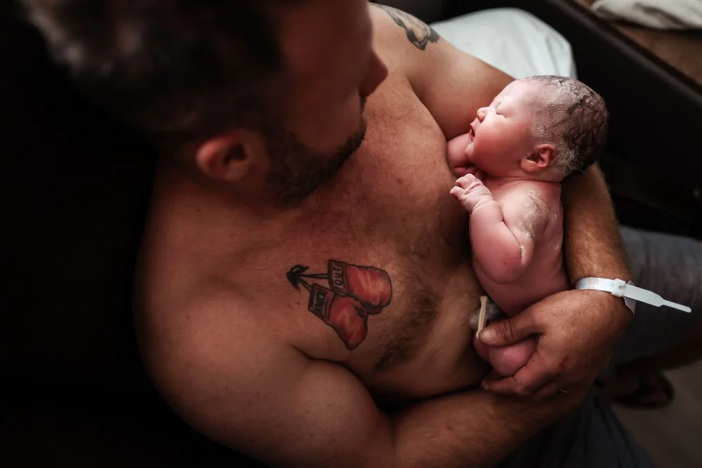 dad and baby after birth