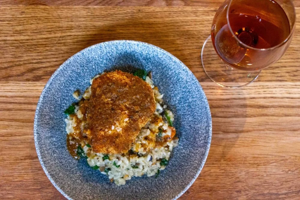 Overhead image of beef cheek fritter with mushroom and idiazabal rice