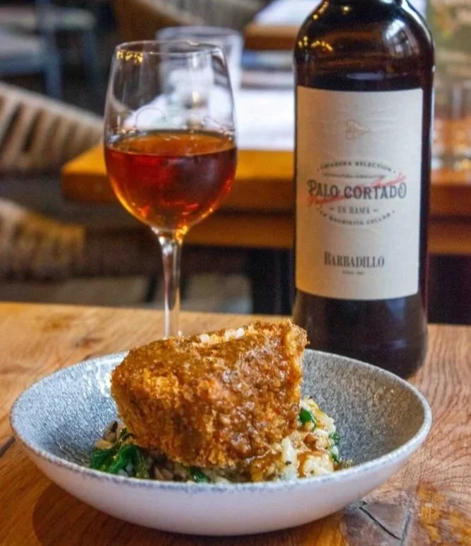 Overhead image of beef cheek fritter with mushroom and idiazabal rice