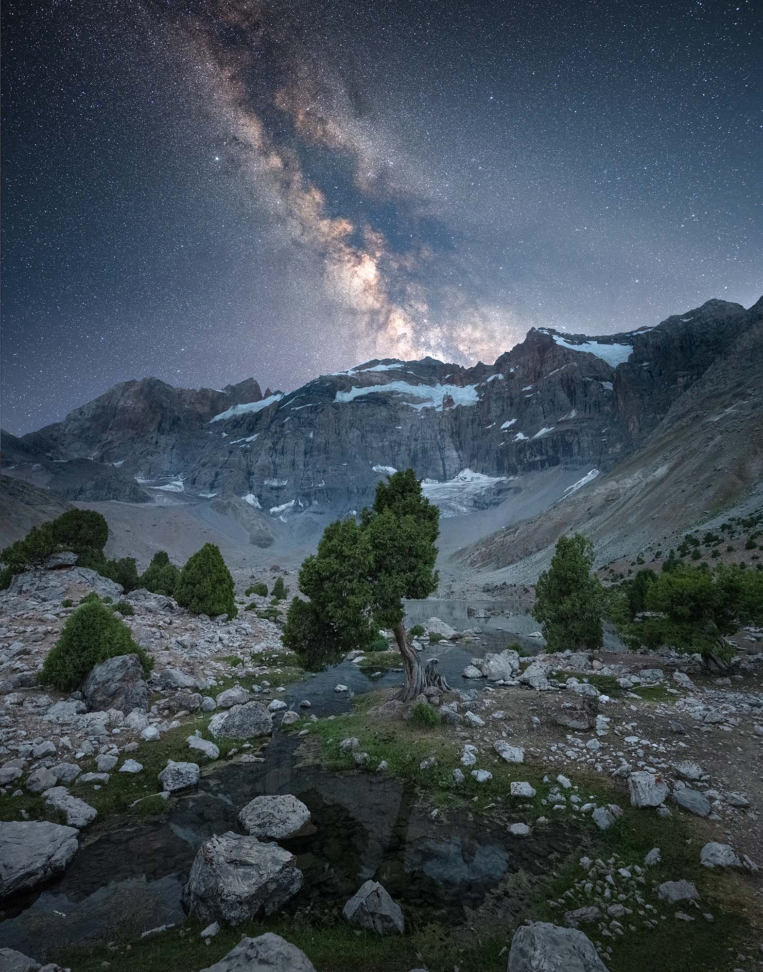 Nighscape with milky way over Fann mountains in Tajikistan.