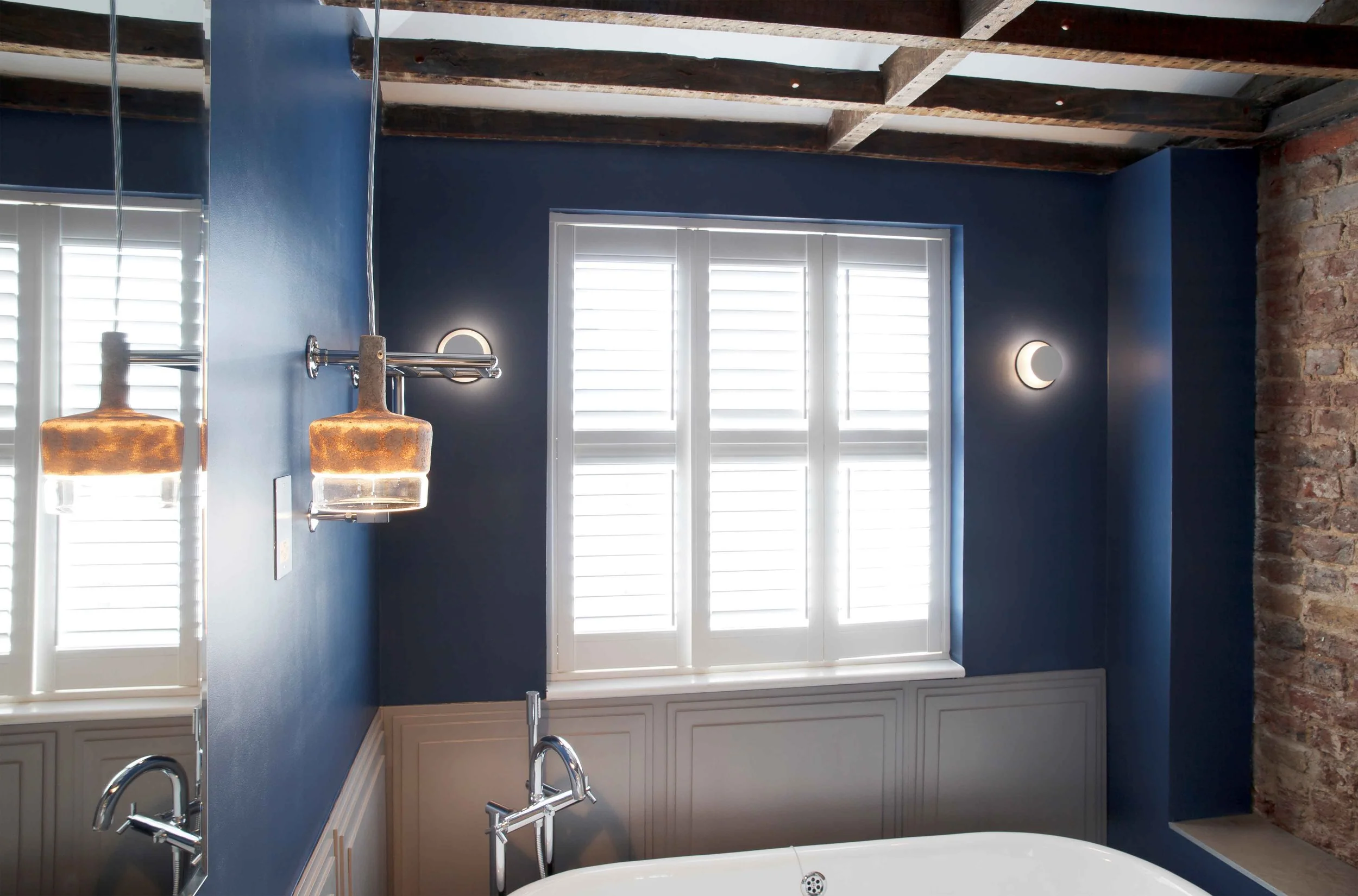 Another view of a bathroom in the Georgian Twins apartments, featuring elegant fixtures and a contemporary layout