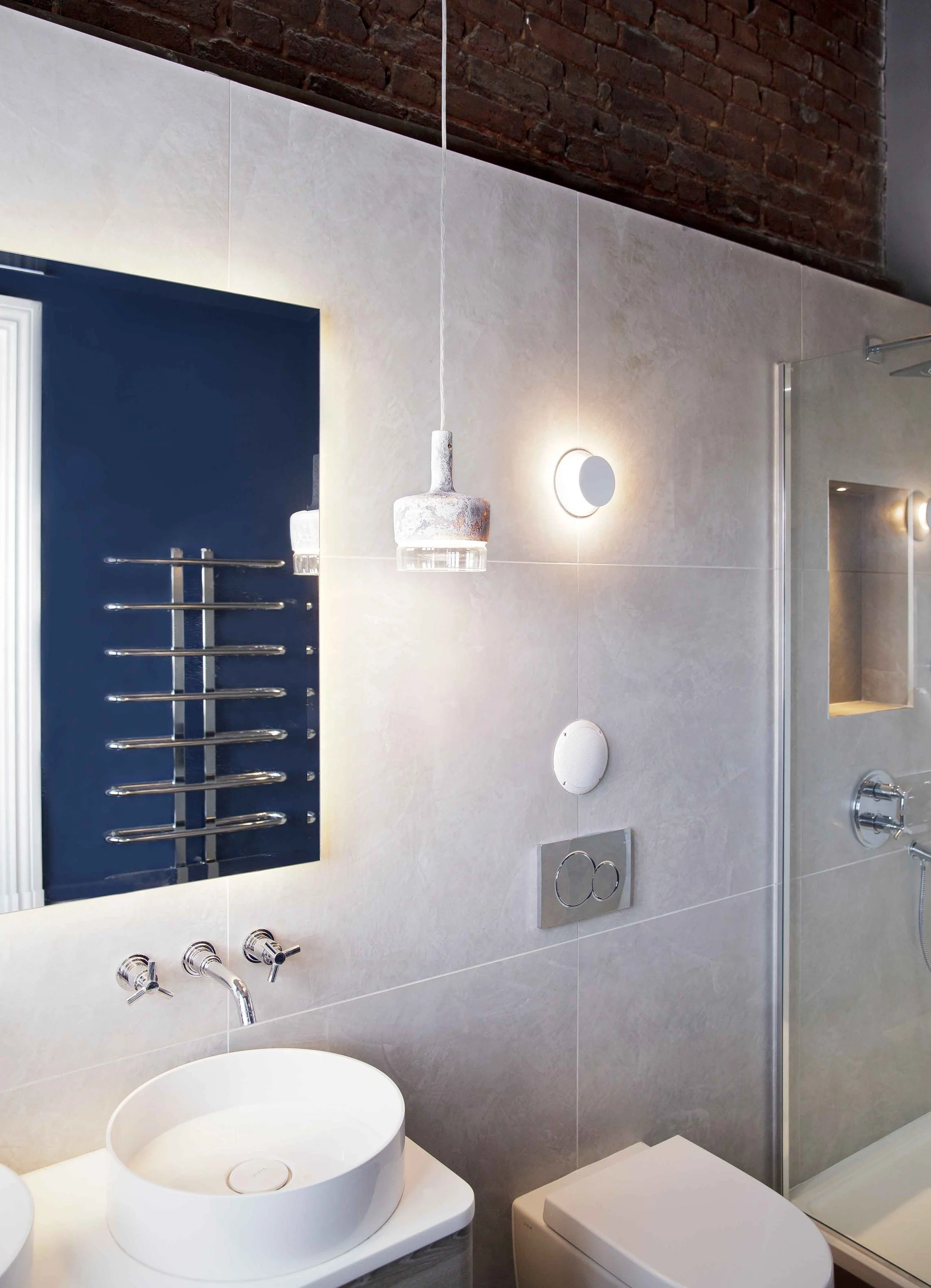 Large matt grey wall tiles with concrete finished pendant and Little Greene Hicks Blue paint