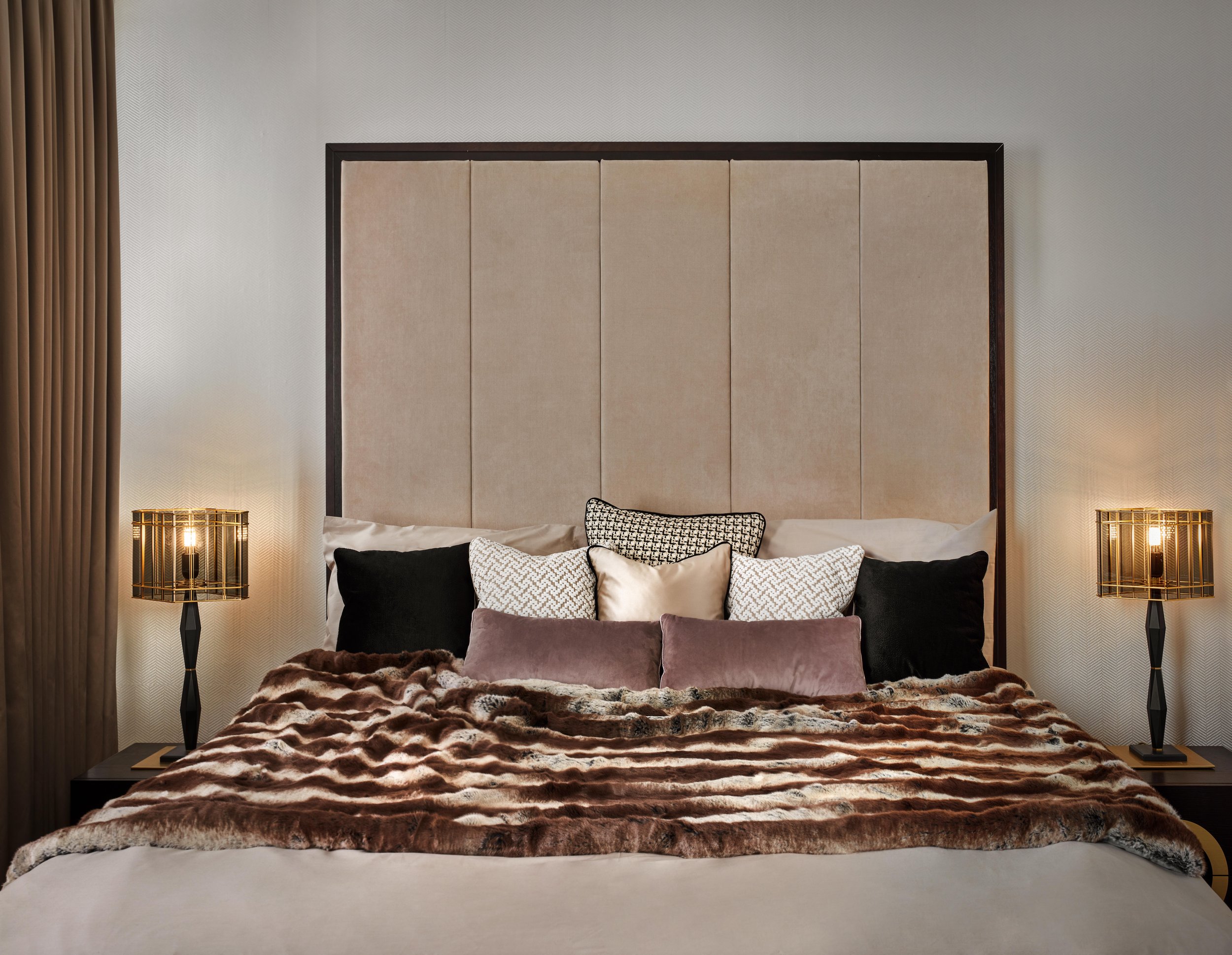 Full view of the master bedroom, combining elegance and comfort in a cohesive design I plush bedthrow and decorative pillows