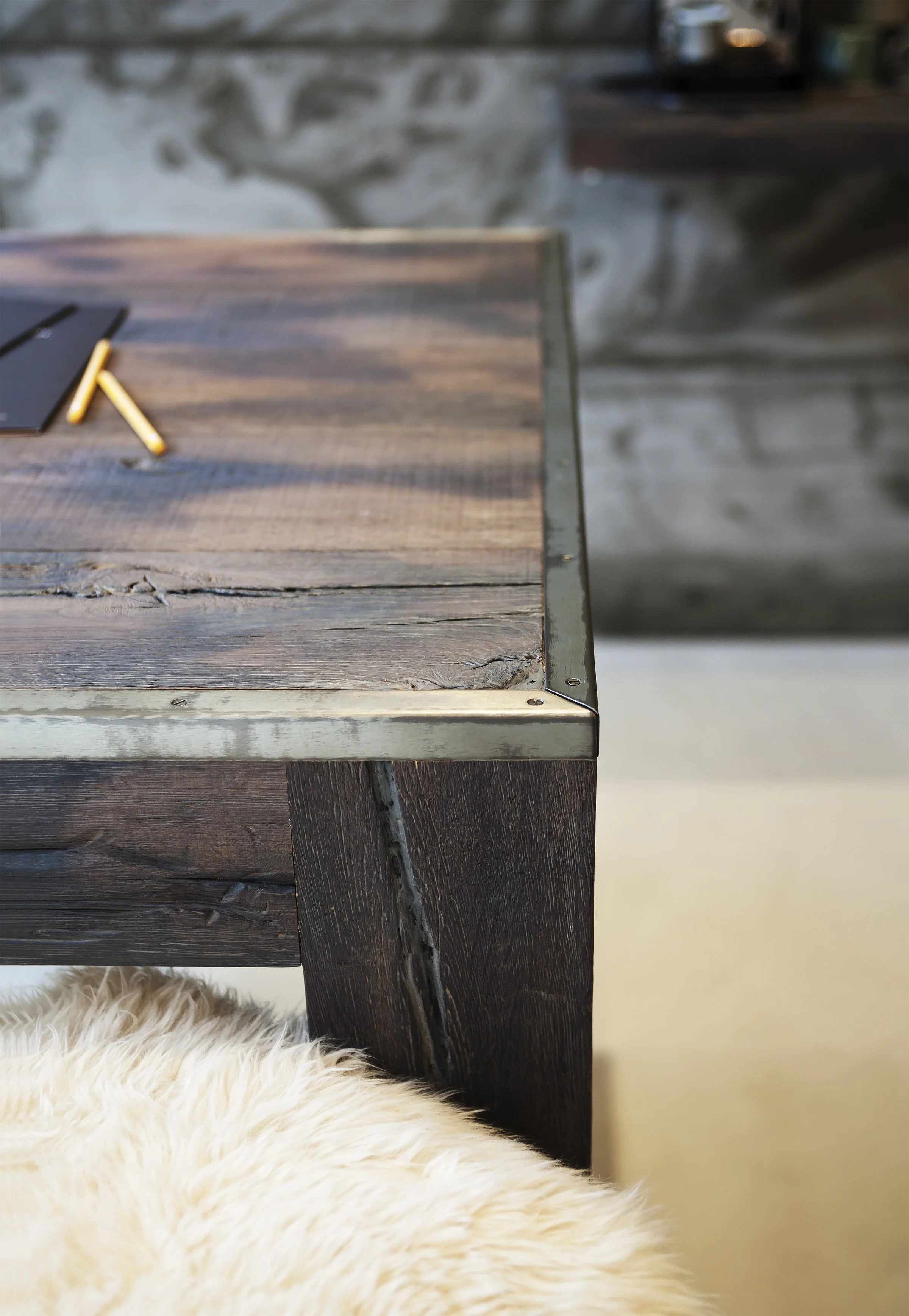 Close-up of the bespoke desk, adding a natural touch to the industrial design