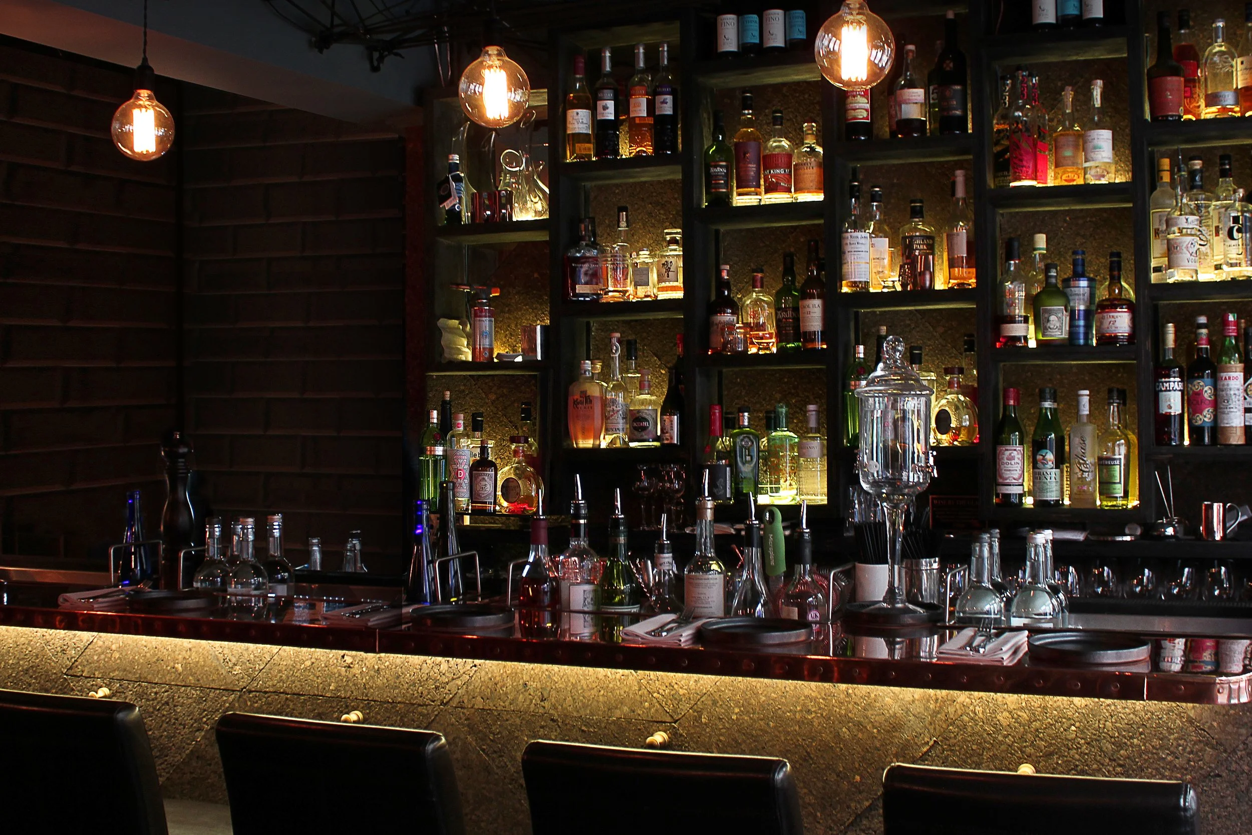 Copper-clad bar at Duende, serving as the focal point of the intimate restaurant