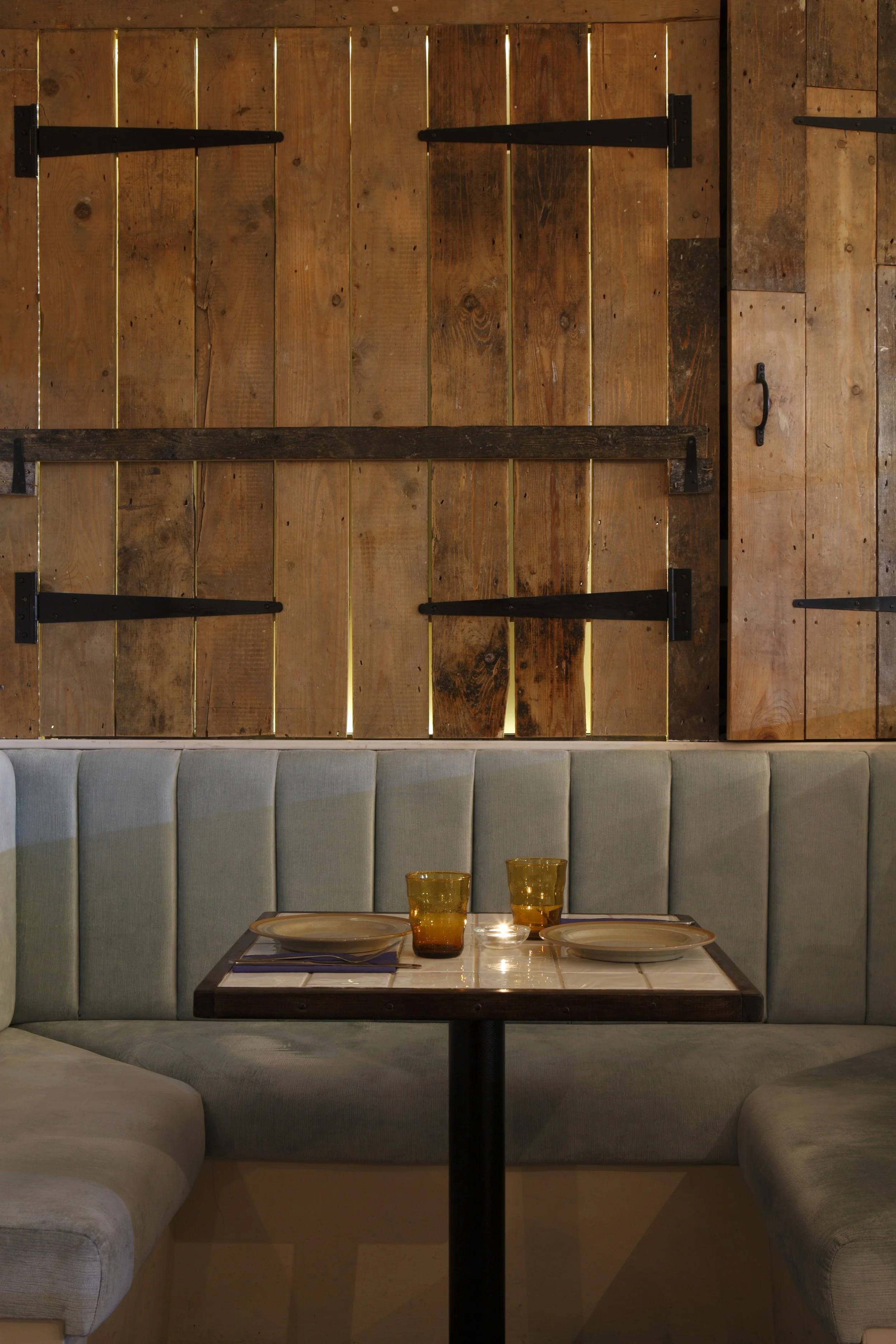 Dining area at Apulia, blending understated design with vibrant southern Italian hues