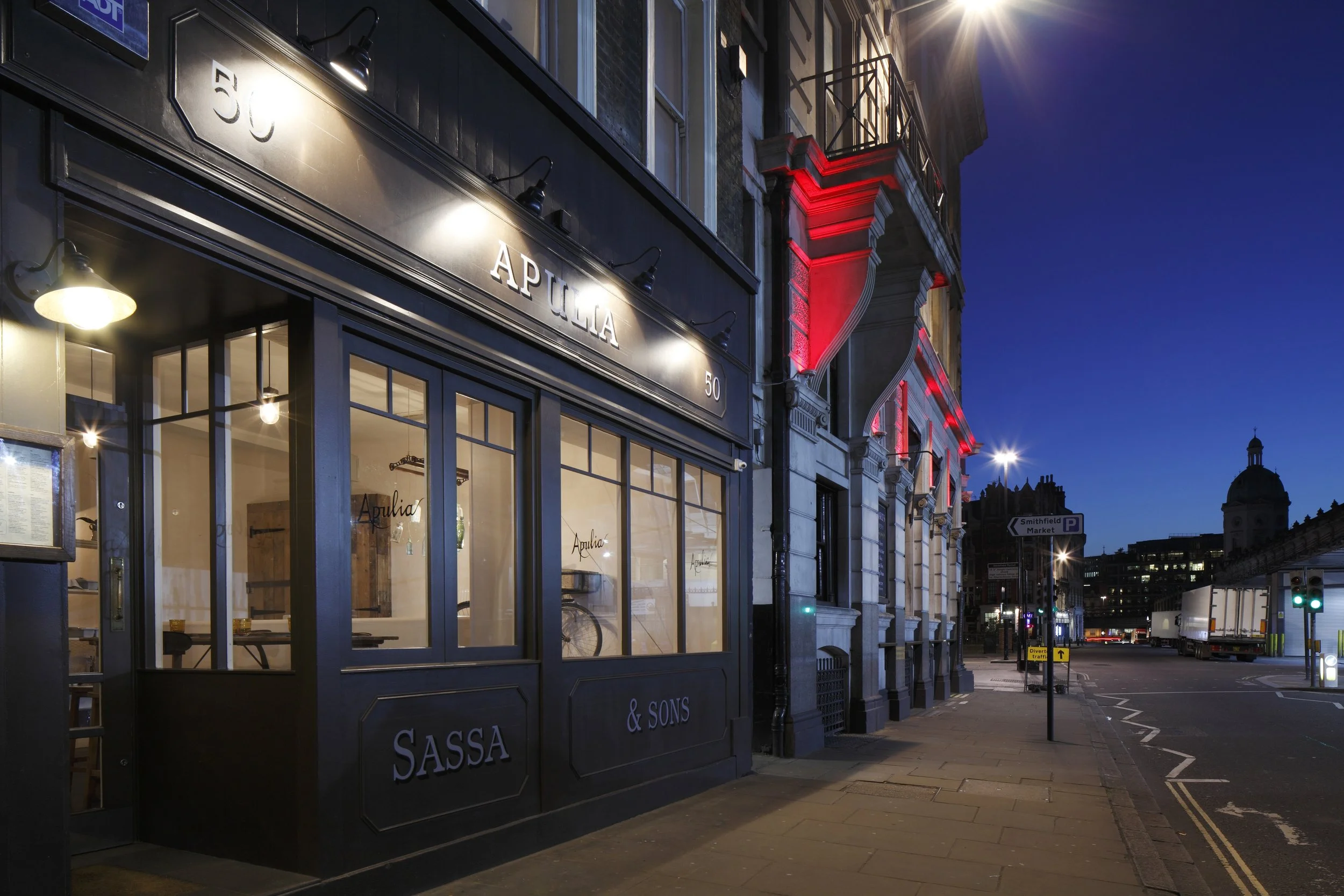 Exterior view of Apulia, a southern Italian eatery opposite Smithfield Market, showcasing its authentic 1940s-inspired design.