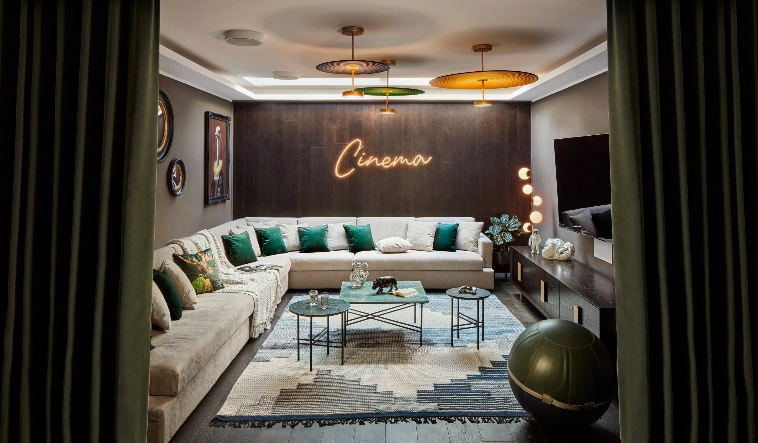 Cinema room in Fulham family home, featuring bold design, cozy seating, and ambient lighting for an immersive experience
