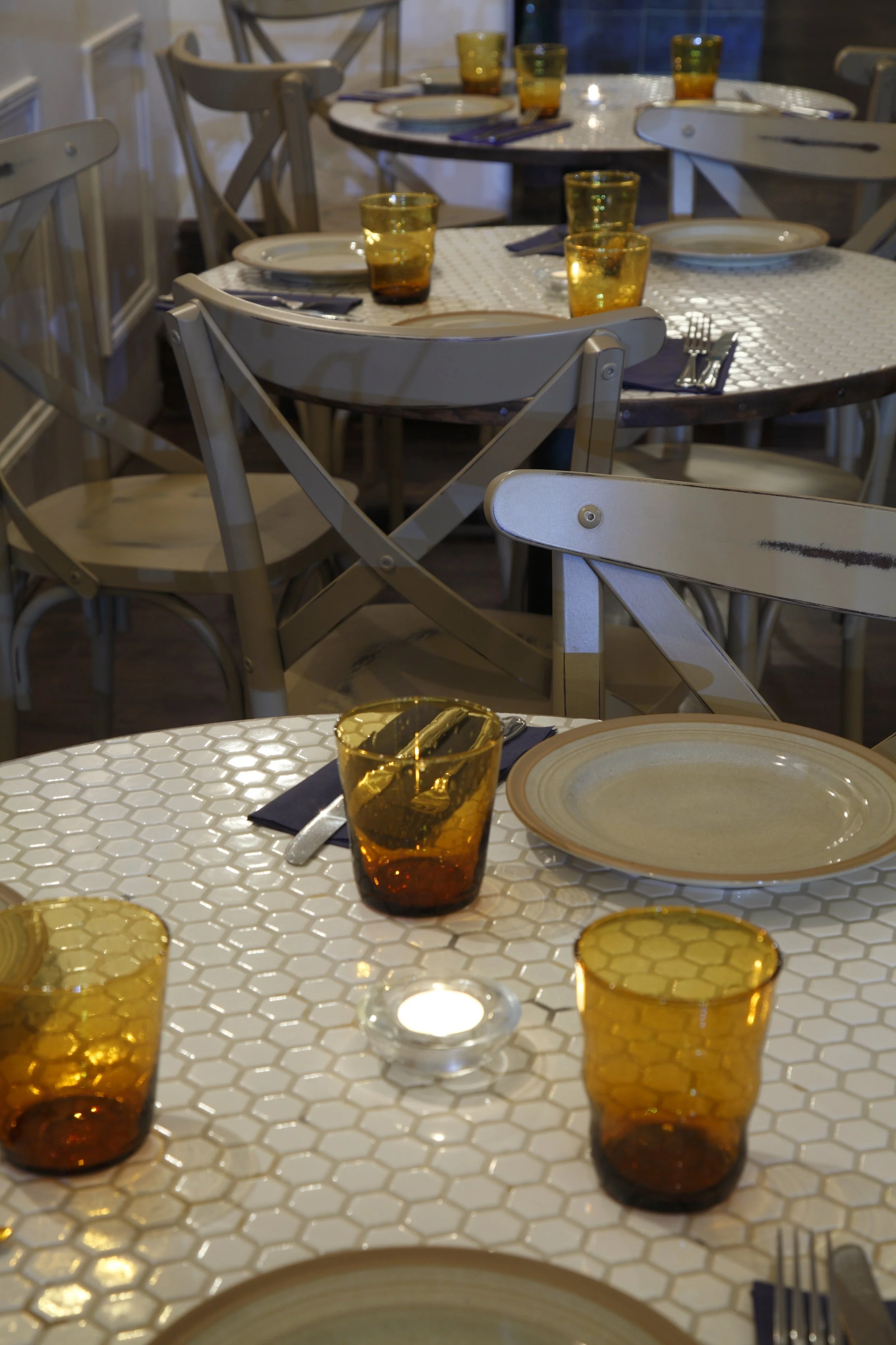 Post war era inspired turmeric glasses and exhagonal small mosaic tables