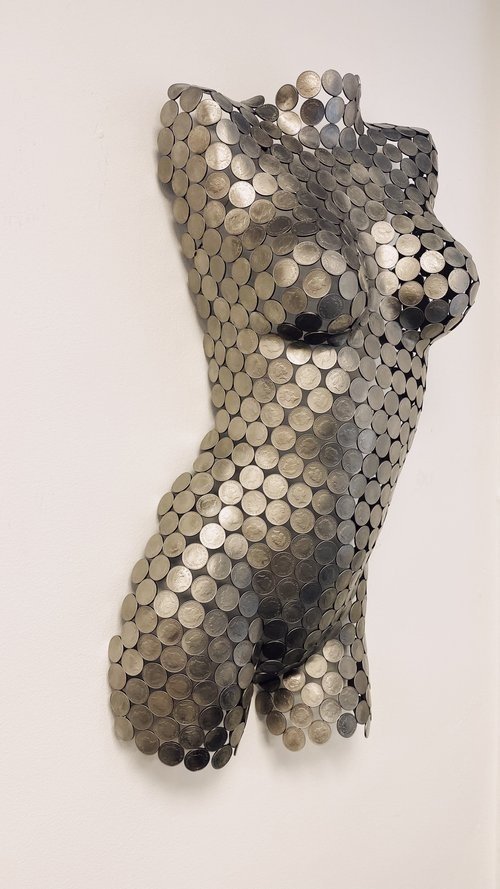 A 10P Torso Front" by Shaun Gagg, a life-size sculpture crafted from 10p coins. It can be displayed on a base or hung on a wall, offering flexible options to showcase the detailed front-facing design.