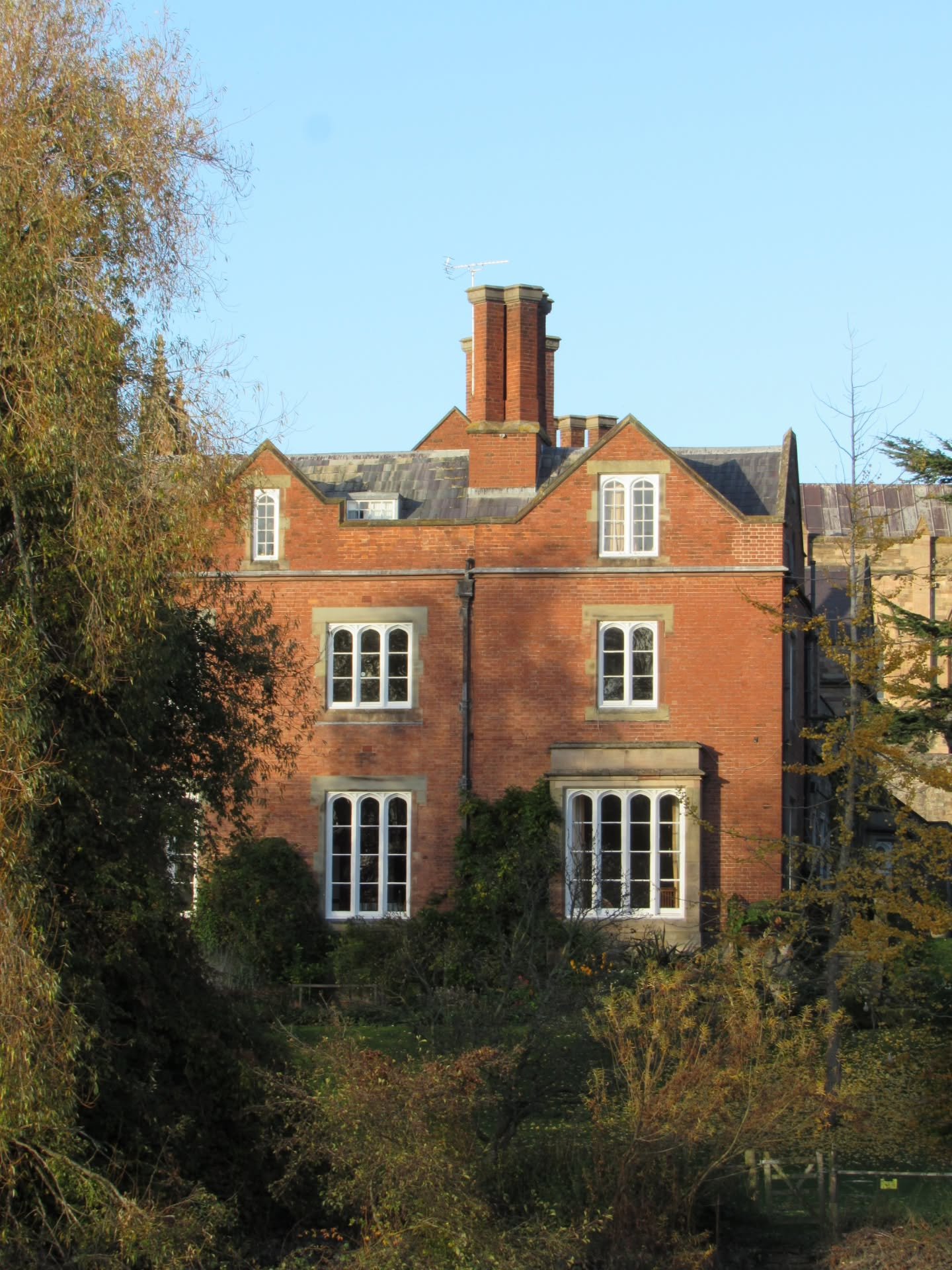 Peeking out through the trees along the north bank of the River Wye is the south wing of the Bishop's Palace in Hereford.

This has to be my favourite view of the building, as the red brick and sandstone dressings compliment each other very well, and