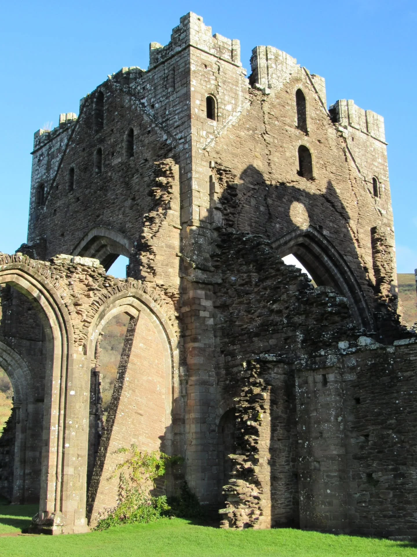 Situated in the scenic Vale of Ewyas, just on the with England, are the ruins of Llanthony Priory. The priory was founded as a church in 1108, and a decade later became a house of the Augustians, who were also known as Black Canons due to the colour 