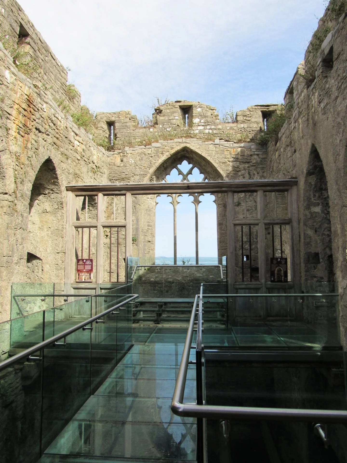 One of the most striking aspects of Oystermouth Castle in Mumbles, Wales is Alina's Chapel, which was added to the structure during the first half of the 14th century.

Access to it is granted by a modern glass walkway, from which many fine features 