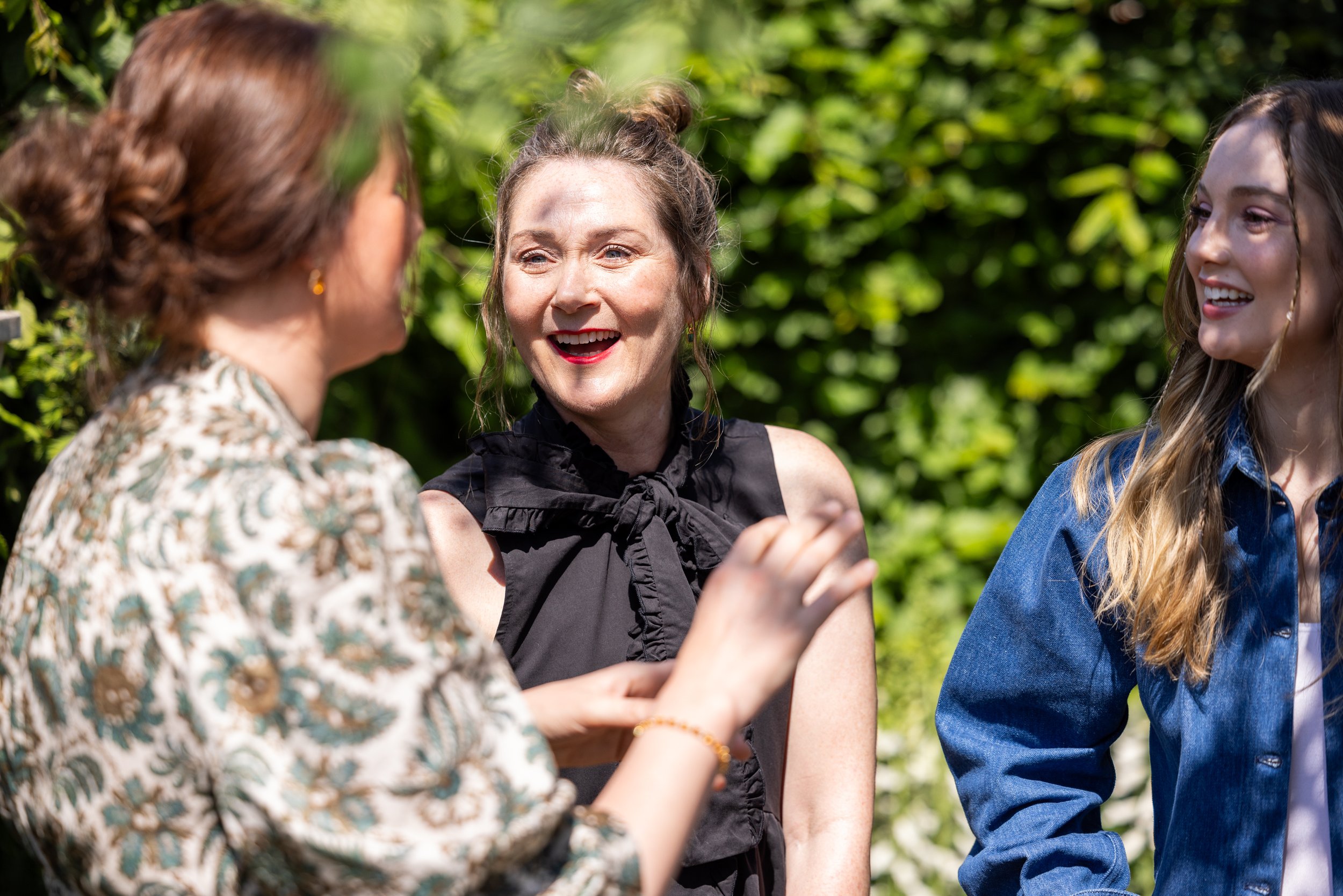 Bridgerton actresses Ruth Gemmel and Hannah Dodd speak with designer Holly Johnston in the Bridgerton Garden.