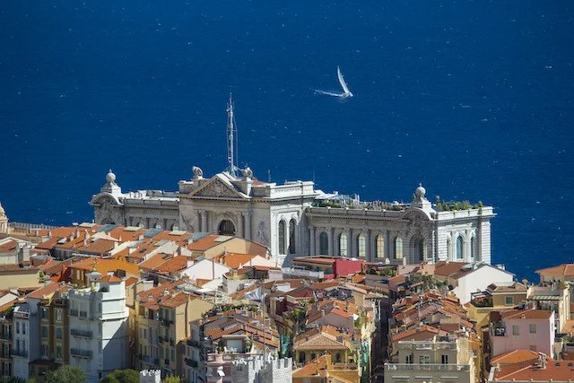 view of Monaco and oceanographic museum with sailing yacht
