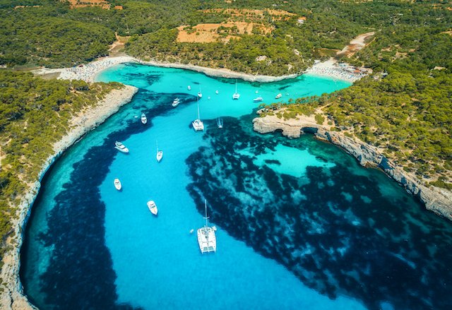 sailing yachts in a cove in ibiza