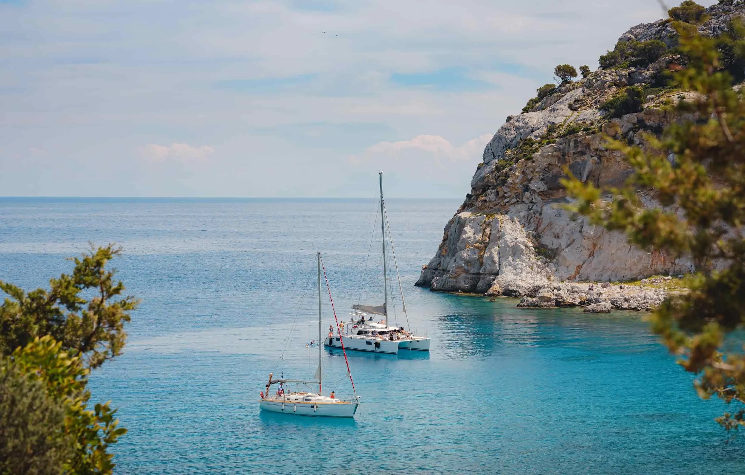 charter yachts anchored in a secluded bay