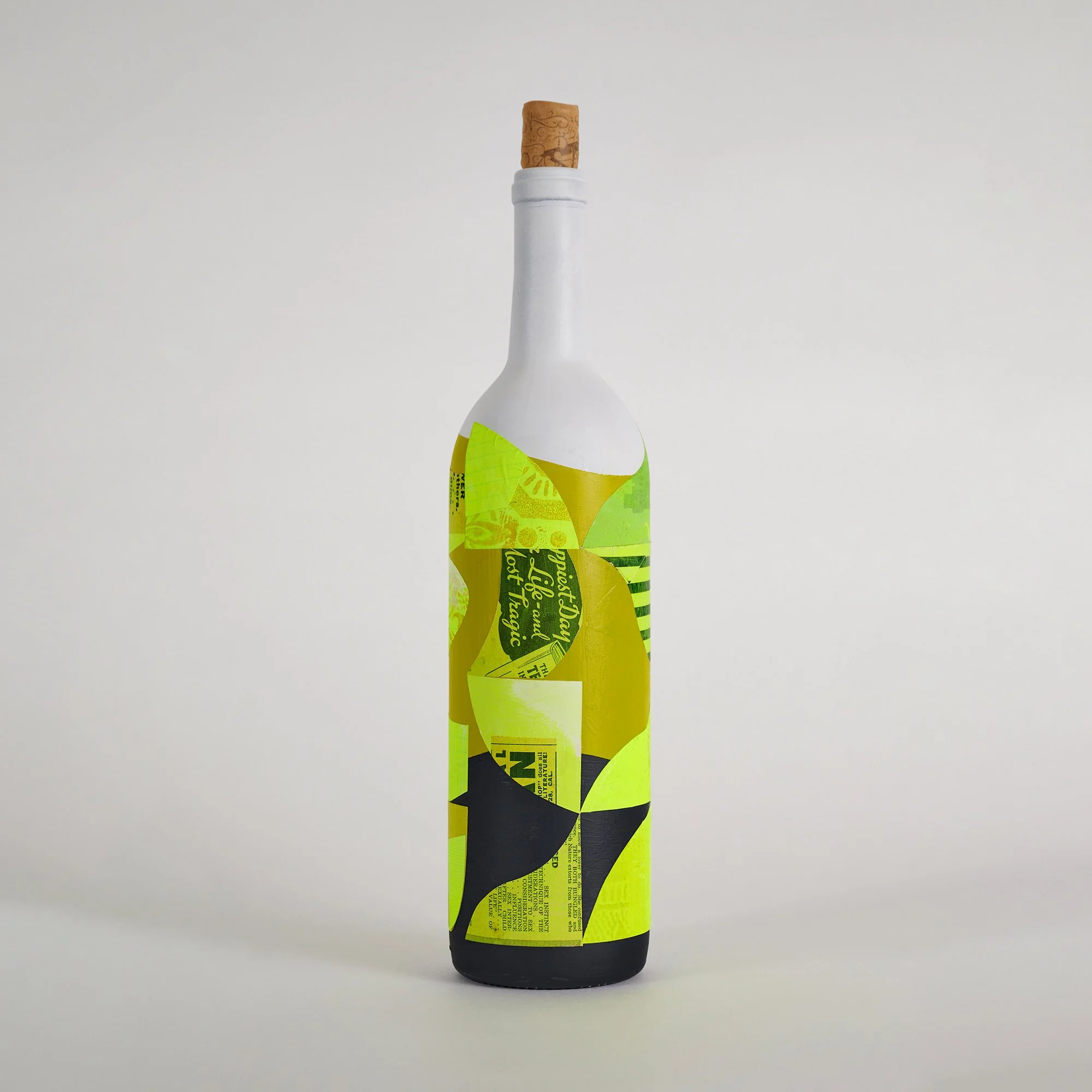 Family Portrait #3: Wine, Collage on found bottle, 12" high. Price: $500