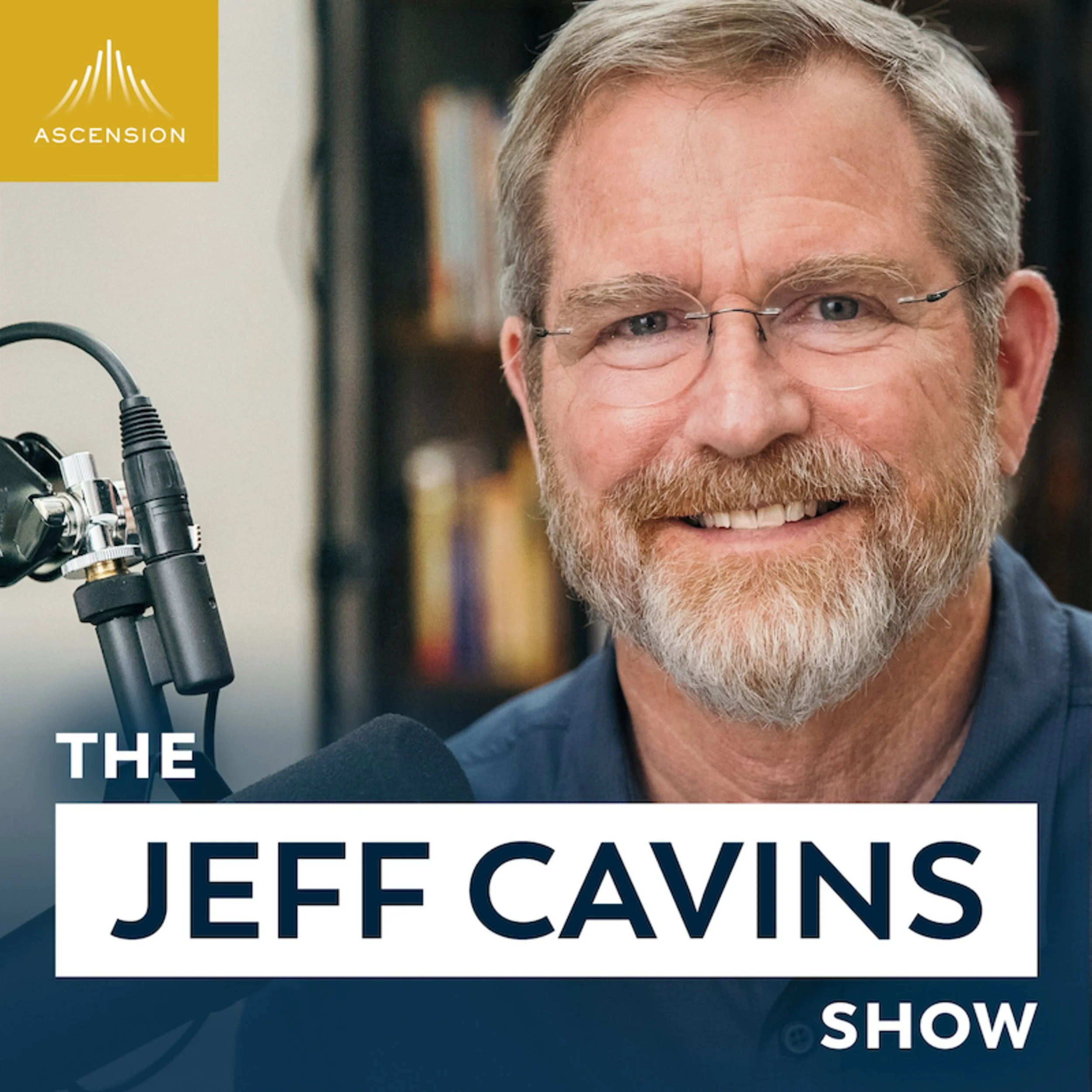 Close-up of Jeff Cavins smiling, with glasses and a beard, in a studio setting with a microphone and bookshelf in the background, promoting The Jeff Cavins Show podcast.