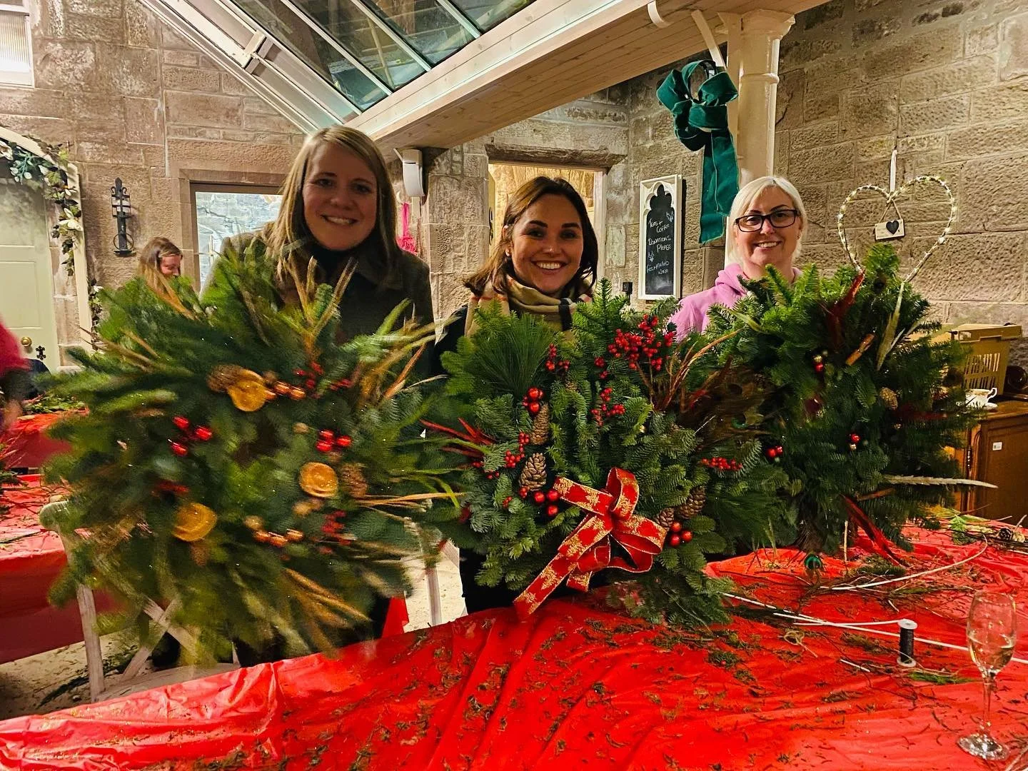 Guests creating Christmas wreaths at Culdees Castle