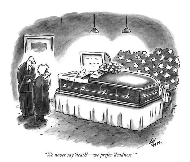 A black and white cartoon showing a coffin with flowers on top, a body inside, and two people standing nearby in mourning. The caption reads, "We never say death—we prefer deadness."