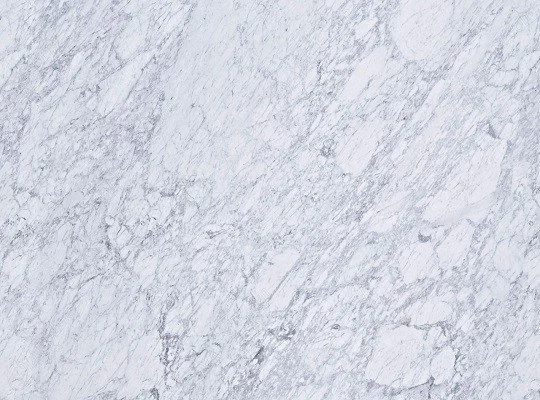 Patterned marble surface with light gray and white veining texture