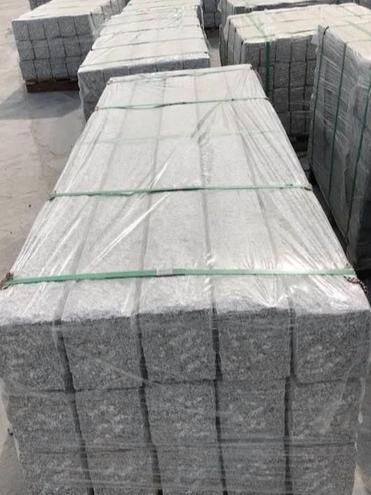 pallets of stacked concrete bricks wrapped in plastic