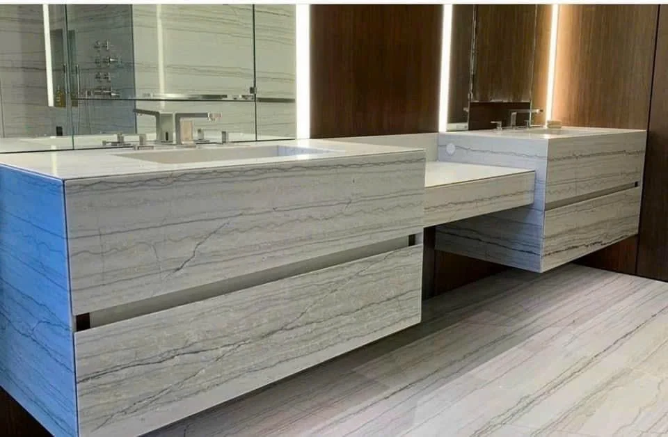 Modern bathroom with marble vanities and mirrors