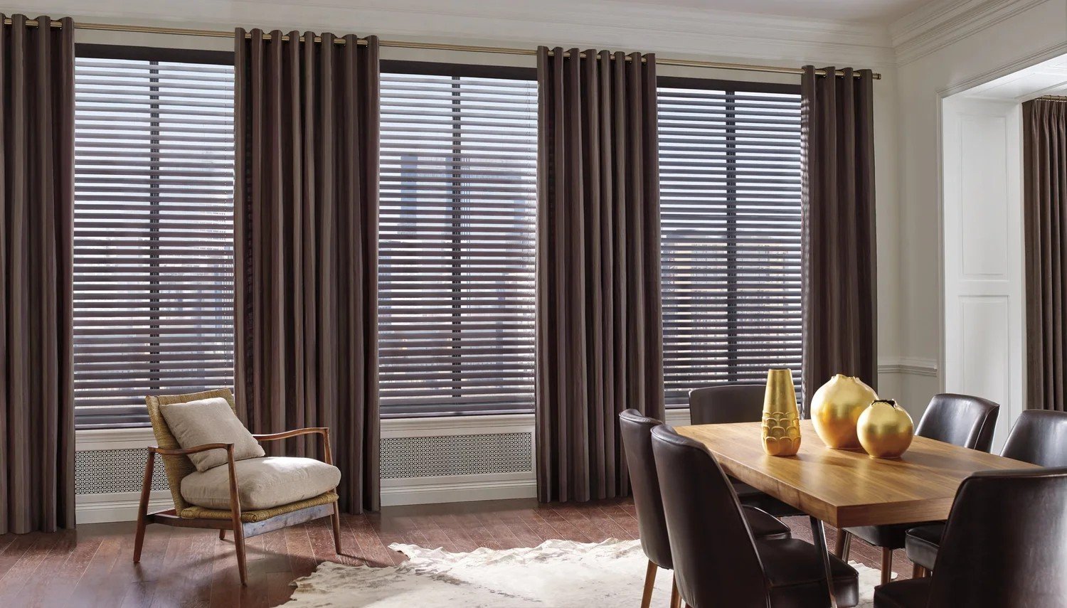 Dining room with Hunter Douglas Parkland wood blinds