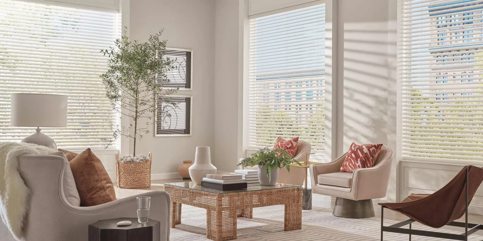 Hunter Douglas Aria Soft Blinds in a bright living room with floor-to-ceiling windows