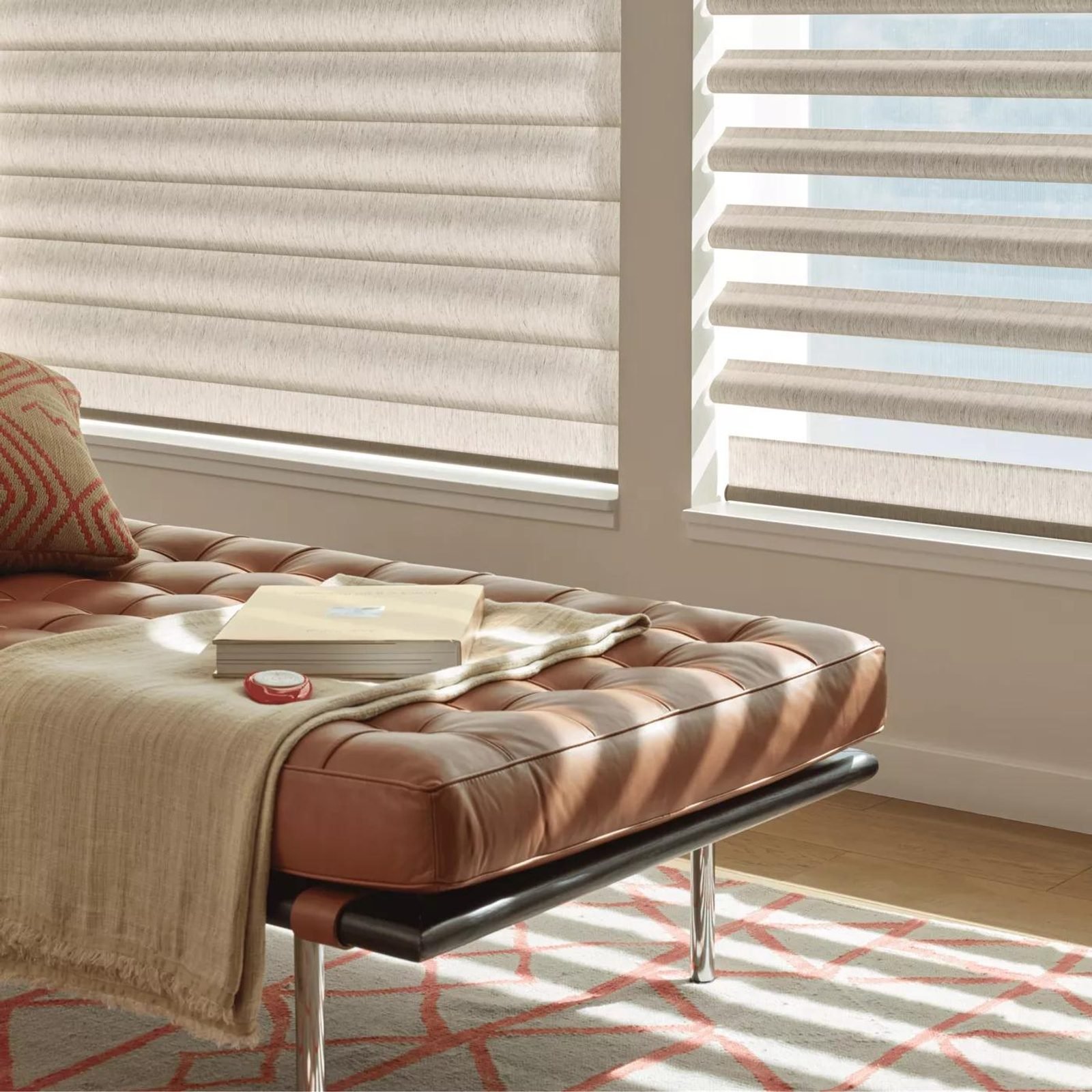 Hunter Douglas Pirouette window shadings in a reading nook