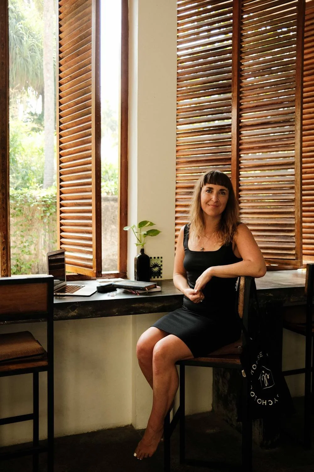 Dr Stephanie Minchin working at a desk by a window