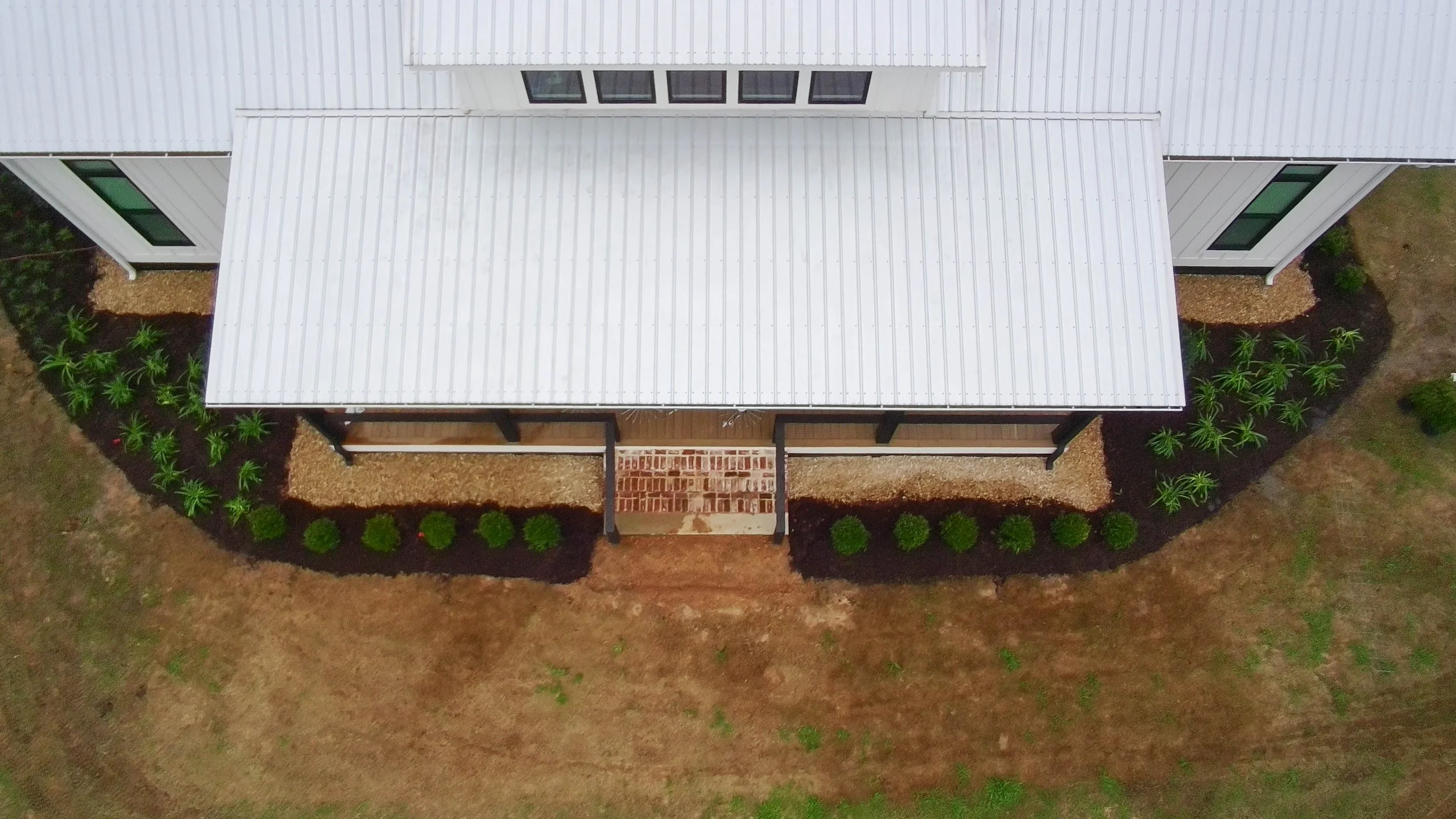drone picture of the front of the house garden bed